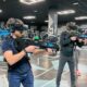 Christmas party venues: a group playing together in a free roam VR arena