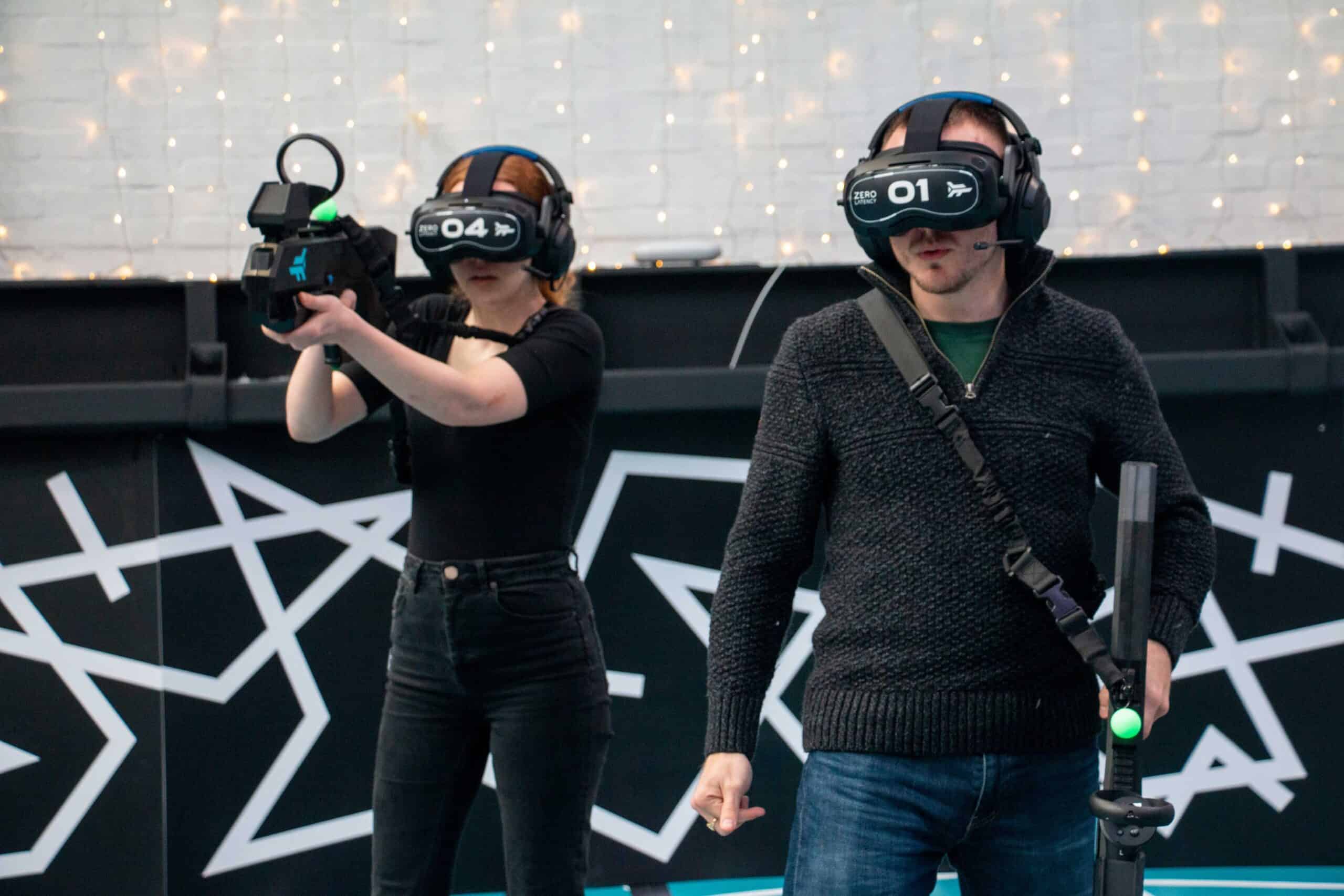 Christmas party venues with a difference: two players in VR headsets under fairy lights