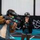 Work Christmas party ideas: colleagues playing free roam VR under fairy lights